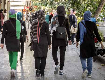 women walking street